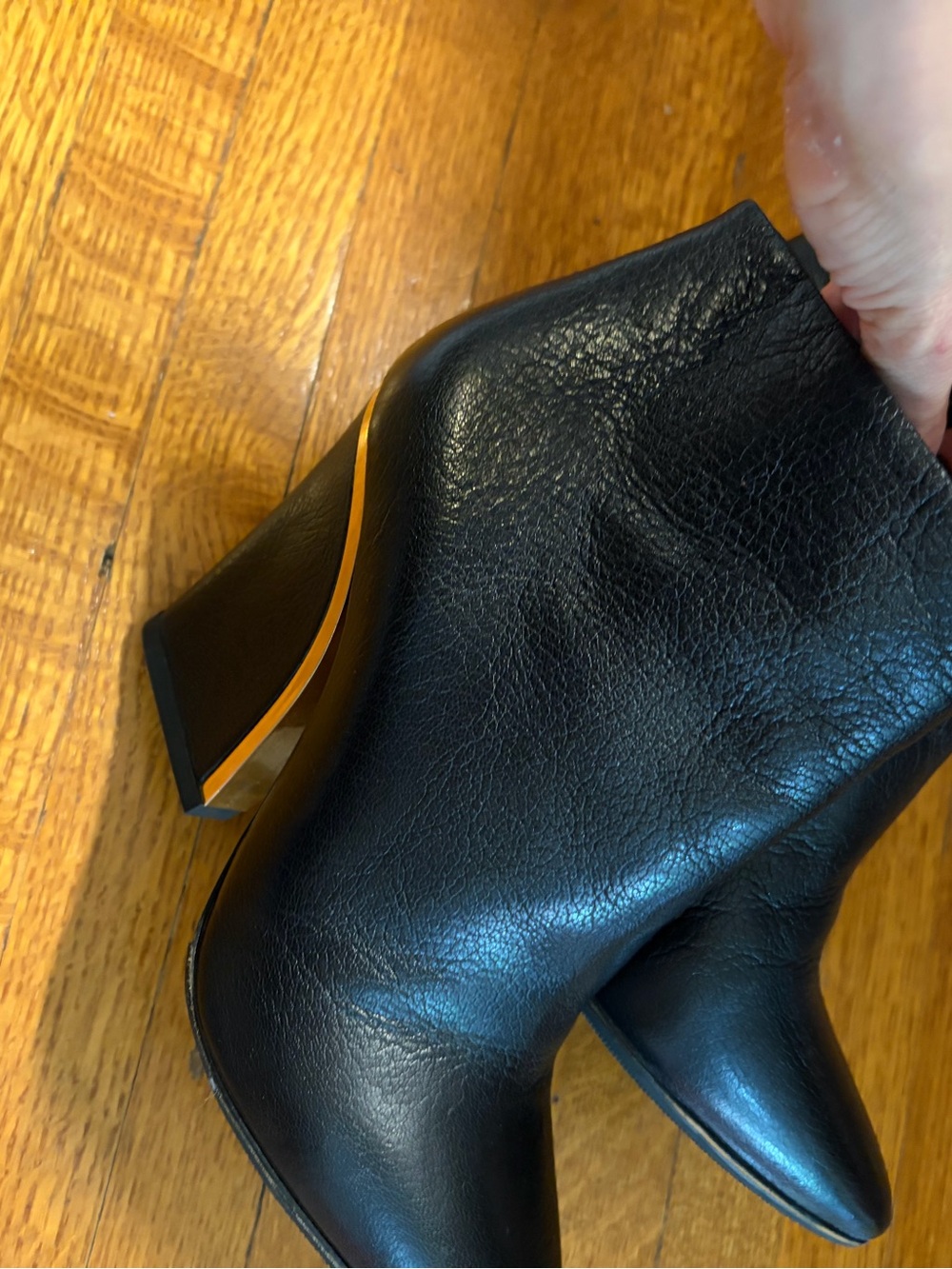 Chloe Black Women's Leather Ankle Boots with Gold Accent